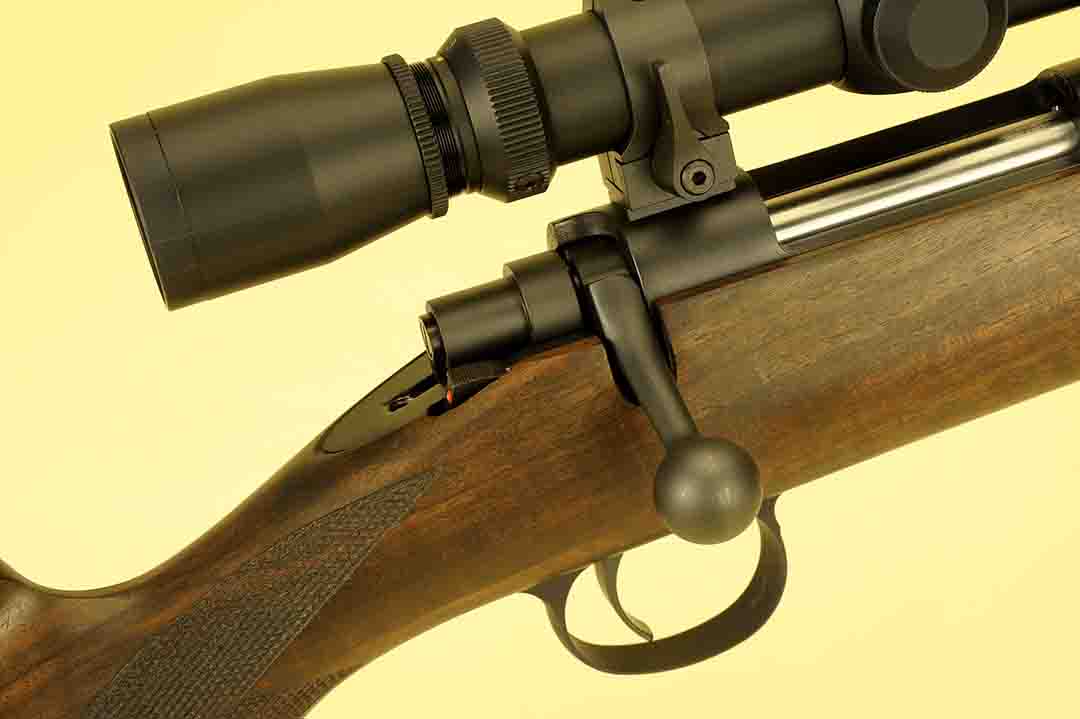 Closer in, the safety is visible just behind the bolt handle. On the Cooper gun, it is two position; forward to fire, back for safe. Detailing on both the wood and metal is first-rate as it should be on a gun of this pedigree.